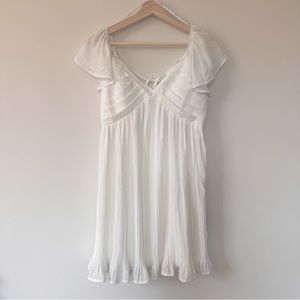 Lulu’s Amalfi Coast White Pleated Flutter Sleeve
Mini Dress - Size XS